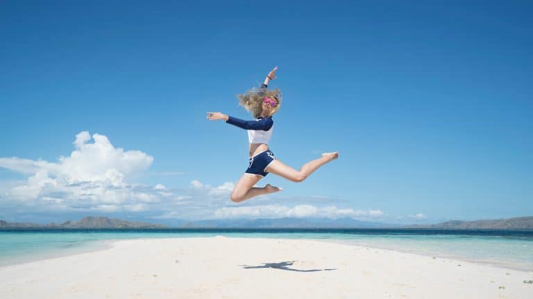 woman jumping for joy for her successful life