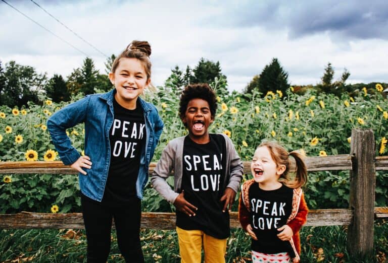 different races children where T-shirts speak love