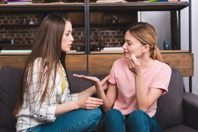 lady consoling her female friend after saying no