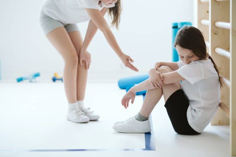 Schoolgirl reaches out to her sad friend in the gym an example of being there for someone