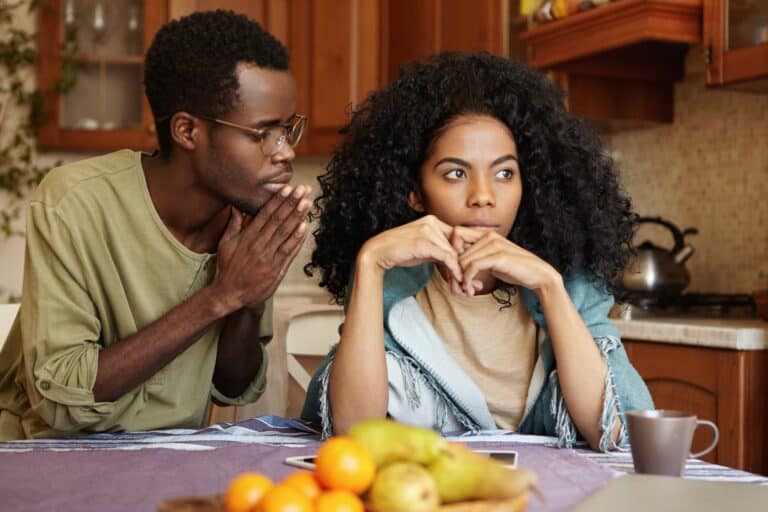 Afro-American couple going through hard times in their relationships. Guilty unfaithful young man ke
